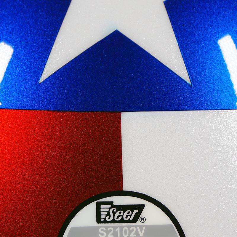 Close-up of Model 1776 Onyx White Pearl Pacific Blue Pearl and Patriot Red paintwork