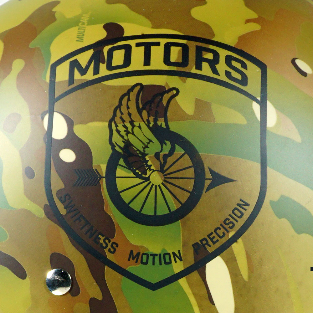 Close-up of the MOTORS Winged Wheel Unit Insignia on the left side