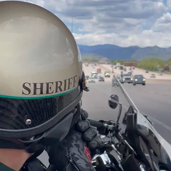 Police Motorcycle Officer on Highway